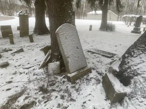 Winter's quiet embrace settles softly on ancient stones.